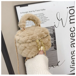 Close-up of a beige plush quilted mini bag featuring a gold chain and soft texture