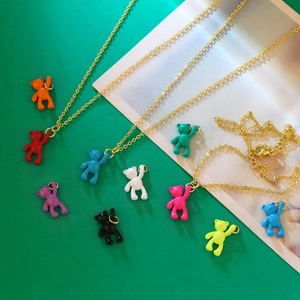 Detail of colorful resin bear pendants on gold-plated link chains in a variety of vibrant hues