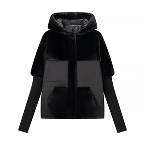 Winter faux fur and down fabric hooded jacket in black with knitted cuffs and studio lighting