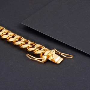 Polished gold stainless steel Cuban link bracelet for men with secure dragon fold-over clasp