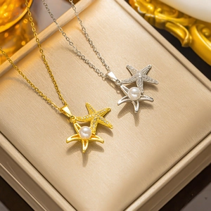 Detailed view of starfish pendants with micro-pave zircons and pearls in gold and silver