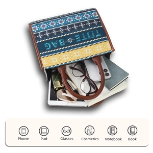 Top view of large capacity tote bag interior showing storage for phone pad and books