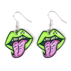 Quirky acrylic earrings with cartoon green lips and pink tongue in a bold artistic style