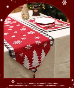 Close-up of red Christmas table runner with snowflakes and classic checkered border