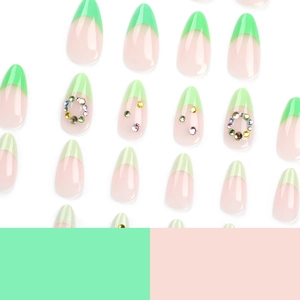 French almond press-on nails in mint green and nude pink with colorful rhinestones