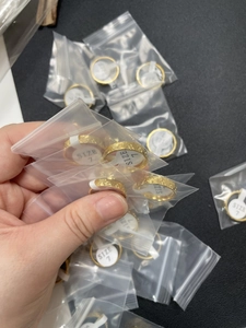 Gold dragon scale rings packaged in individual size-labeled bags from size 6 to 9