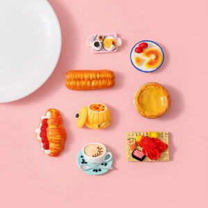Detailed resin miniature food collection featuring tiny fruit tarts and pastries on pink backdrop