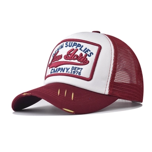 Detail view of 3D New York embroidery and vintage distressed visor on mesh cap