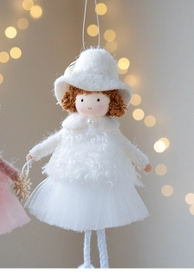 Close-up of plush angel doll pendant with white gauze skirt and gold snowflake
