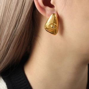 Vintage style gold geometric evil eye stud earrings featuring a sparkling clear zircon stone