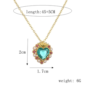 Detail view of heart necklace dimensions 45+5cm length with green crystal and pearls