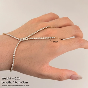 Detail of gold slave bracelet showing zircon settings, 5.2g weight and chain length info