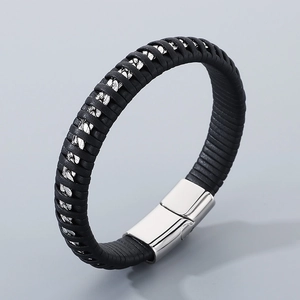 Close-up of men's braided black leather bracelet with silver chain and magnetic metal clasp