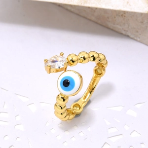 Adjustable golden beaded ring with sparkling teardrop zircon and blue evil eye charm