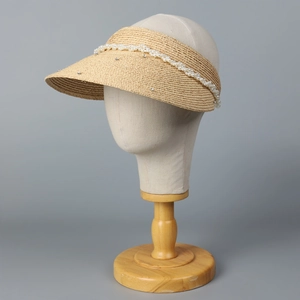 Straw sun visor hat for women with elegant white pearls and sparkling rhinestone accents