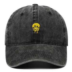 Vintage washed charcoal baseball cap with a yellow melting smiley face embroidery
