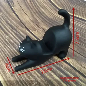 Detailed dimensions of black resin cat phone stand showing 11cm length and 7.5cm height