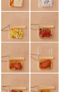 Detailed close-up of miniature lunch box pendants with realistic resin rice and dishes