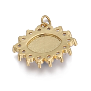 Detailed view of evil eye gold charm with white zircon stones and sunburst edge