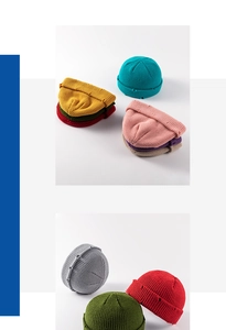 Close-up of thick knit beanie hats showing retro rolled edges and varied color textures