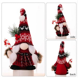 Three-way view of Christmas gnome plush with knitted hat and candy cane decoration