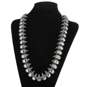 Gothic silver skull chain necklace in punk style displayed on black neck bust
