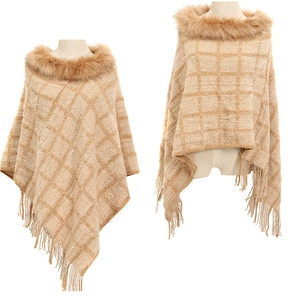 Detail view of beige plaid knit poncho featuring a faux fur collar and fringe tassels