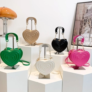 Quilted heart-shaped handbags in five colors with chain handles and cross-body straps