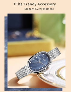 Detail of elegant oval watch with blue mother-of-pearl dial and silver mesh band