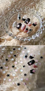Detail of M-977 star nail art stickers with metallic laser glitter effect on nails