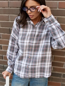 Women's oversized plaid flannel shirt in grey white and pink for a casual street style look