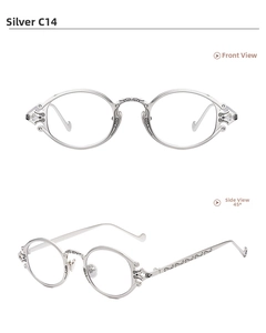 Detail of silver steampunk oval frames with intricate floral engraving and hollow cross hinges
