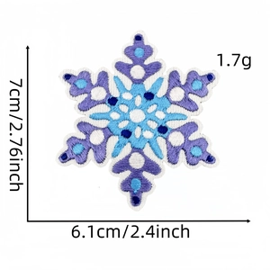 Detailed view of snowflake embroidered patch with dimensions 7cm x 6.1cm in blue and purple