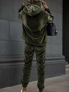 Back view of a premium deep olive green velvet tracksuit with hoodie and joggers