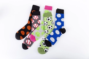Detail of four pairs of athletic cotton socks featuring basketball and football motifs