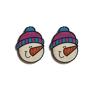 Detail view of snowman earrings with purple striped hats and orange carrot noses