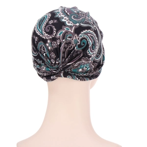 Paisley print headscarf beanie in black with green and purple patterns, back view