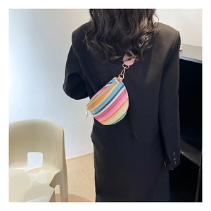 Detailed back view of a colorful bohemian straw waist bag with adjustable wide shoulder strap