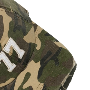 Close-up of distressed camo baseball cap with white 3D letter embroidery details