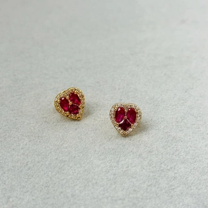 Elegant gold heart earrings with red zircon crystals and white micro-pave detailing