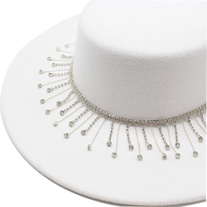 Close-up of white felt fedora hat featuring elegant silver rhinestone tassel detailing