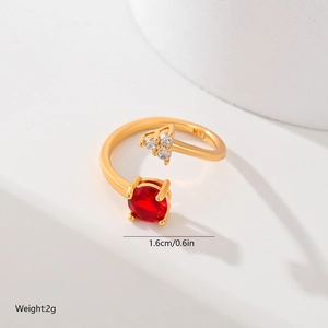 Detailed view of leaf ring with red stone and zircons including size and weight specs