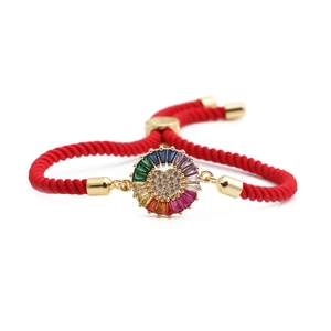 Adjustable red braided bracelet with a golden heart-shaped zircon center in ethnic style