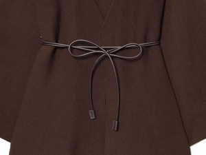 Detailed view of the dark coffee knit cardigan featuring waist belt and ribbed texture