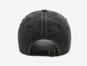 Rear view of washed denim baseball cap with contrast stitching and metal buckle