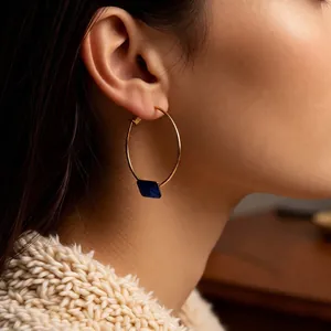 Chic 24k gold-plated hoop earrings with square blue gemstone pendant on model