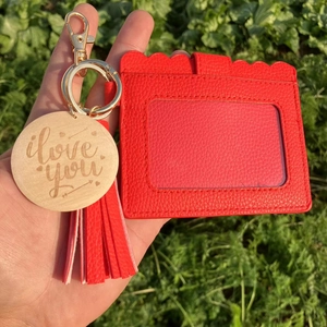 Red lychee leather card holder with tassel, wooden heart charm and gold keychain