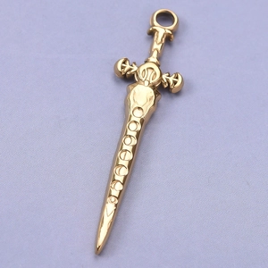 Macro shot of 304 stainless steel golden sword pendant with polished metallic finish