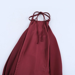 Detail of burgundy satin halter neck with elegant pleated collar and tie-back strings