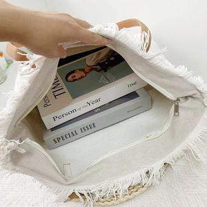 Large white canvas tote bag with stylish fringe detail and brown faux leather handles
